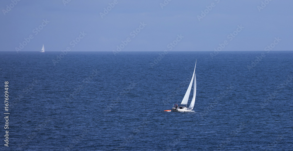 Sailboat on blue sea