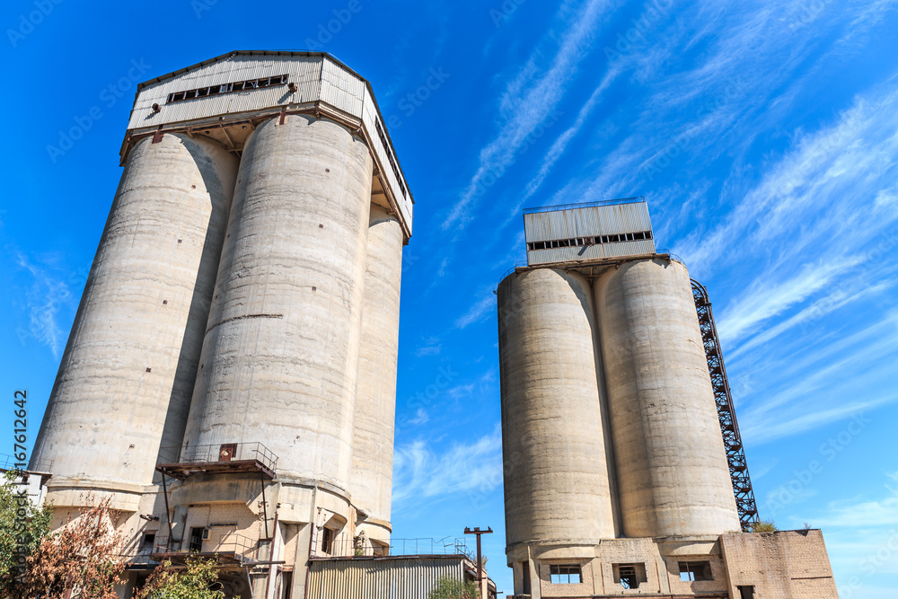 Two concrete towers of agricultural elevator Two concrete towers of agricultural elevator