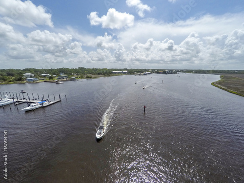 Boaters on Steinhatchee River at Gulf of Mexico, Florida photo