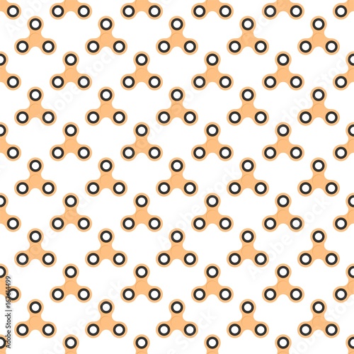 Background from orange children fidget spinners on white background. Playing backdrop of hand twisting toys with bearings in a row next to each other and alternately under him 