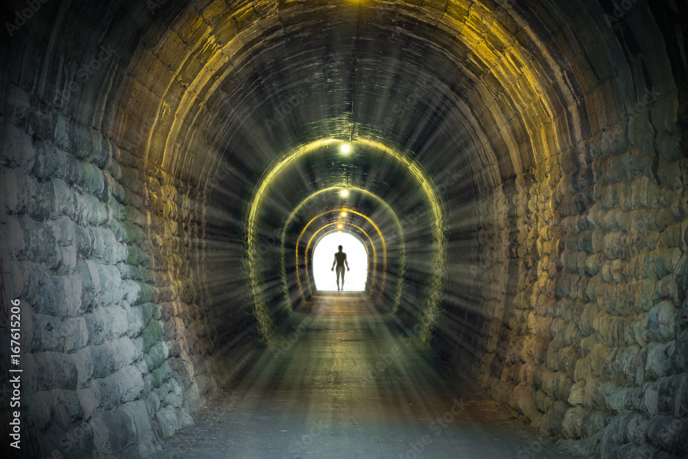 Fototapeta Light at the end of ancient narrow tunnel with man silhouette standing. Life after death, problem solving conceptual illustration