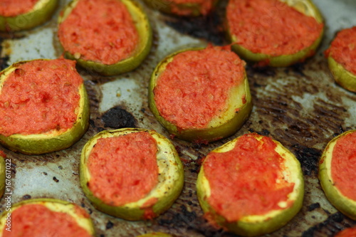 Sliced zucchini in tomato cooked in oven