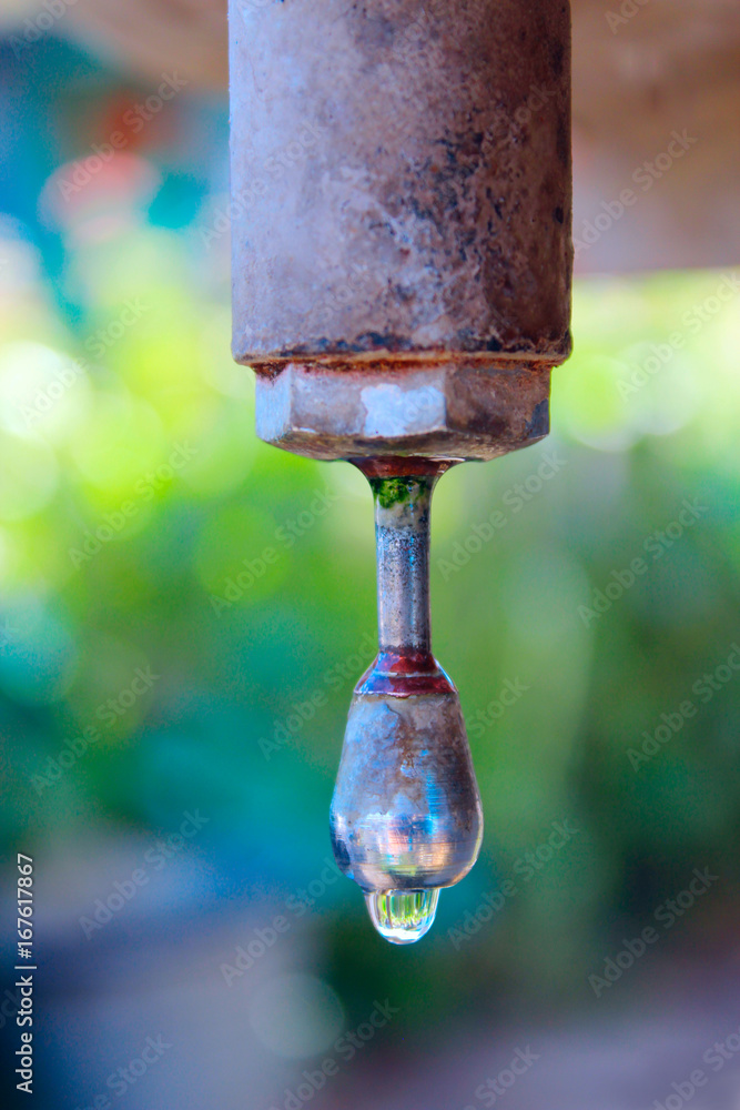 drop of water dripping from the washbasin drop of water dripping from the washbasin