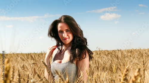 Pretty woman in the field close up portrait