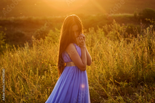 Beautiful, tender girl at sunset