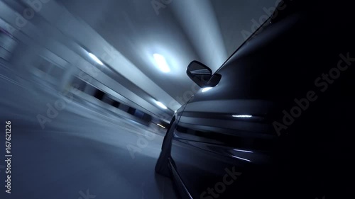 Time lapse wheel reflecting in parking garage 