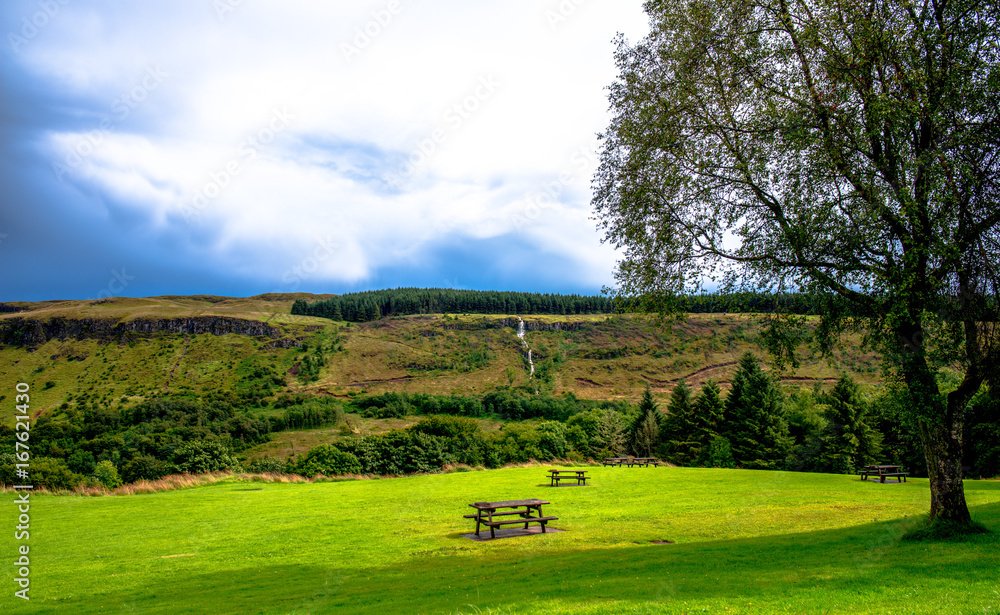 Obraz premium Waterfall Trail at Glenariff Forest Park, Co. Antrim. Hiking in Northern Ireland. Causeway Coastal Route.