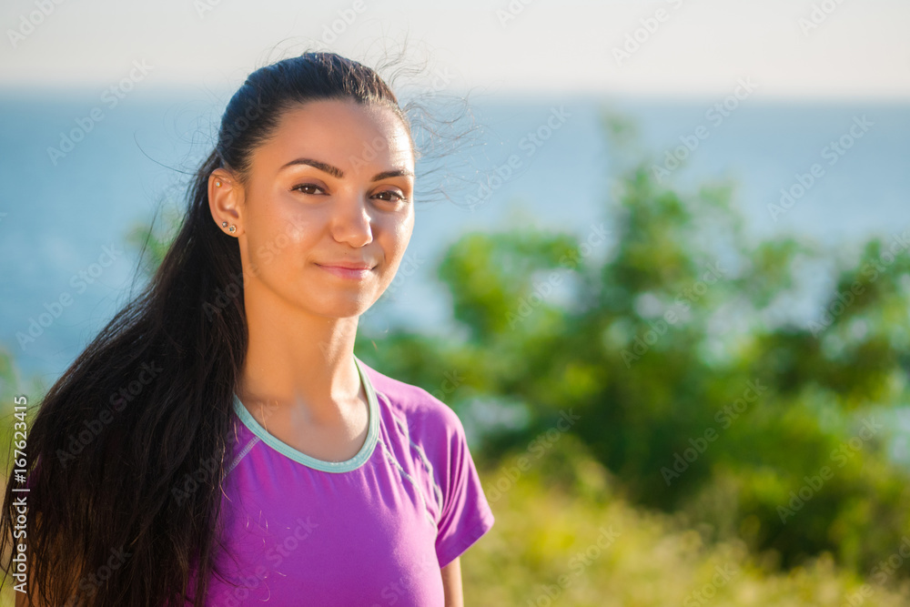 Profile portrait of happy sporty woman relaxing in park. Female model relaxing, breathing fresh air outdoors. Healthy active lifestyle concept. Copy space Profile portrait of happy sporty woman relaxing in park. Female model relaxing, breathing fresh air outdoors. Healthy active lifestyle concept. Copy space