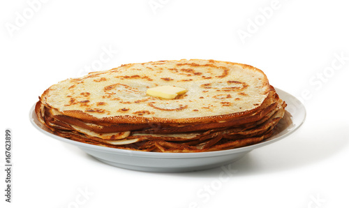 Pile of crepes on plate on white background