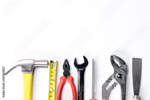Wallpaper Mural Top view of Working tools,wrench,socket wrench,hammer,screwdriver,plier,electric drill,tape measure,machinist square on white background. flat lay Torontodigital.ca