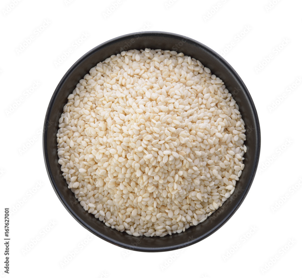 White sesame in a bowl on white background White sesame in a bowl on white background