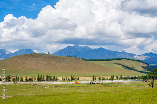 Beautiful scenery in the foothills of Eastern Sayan, Mongolia. In the center of the frame is the peak Munku Sardyk - the highest peak of the Sayan mountains 