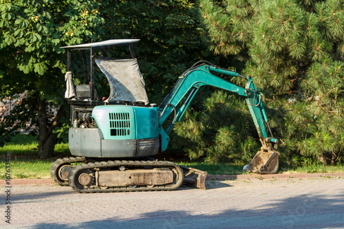 Small excavator in the park