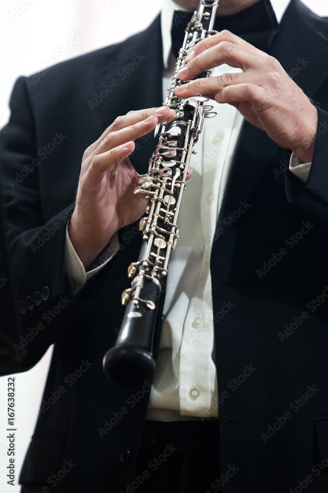 Fototapeta premium Human Hand playing the oboe