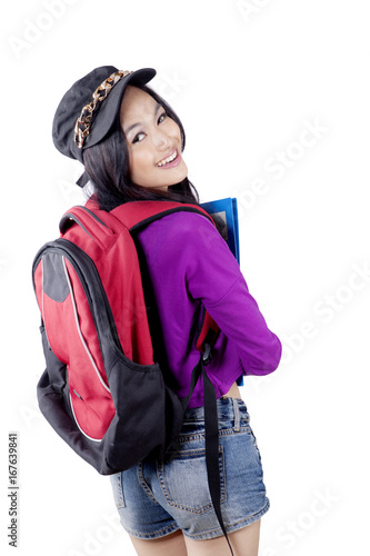 Obraz na płótnie Asian high school student carrying rucksack w salonie