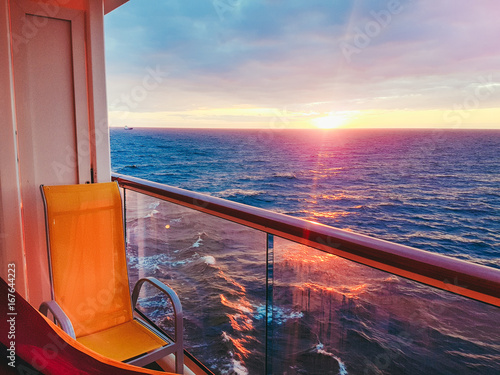 view from a cruise ship balcony at sunset photo