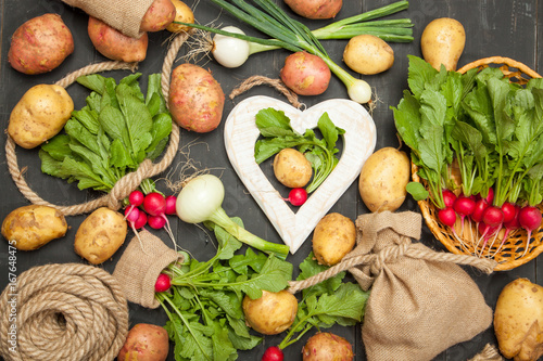 Fresh vegetables on a black wooden background