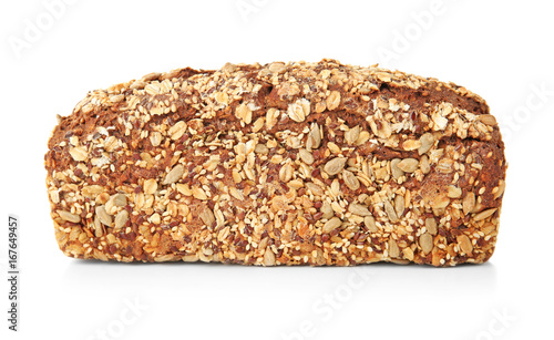 Tasty loaf of bread with cereals on white background