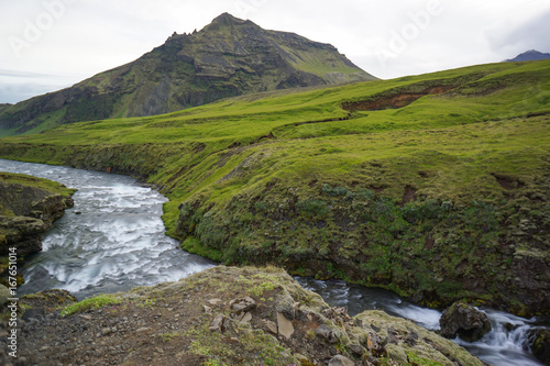 Mountain view of Skogarfoss waterfall, Iceland.