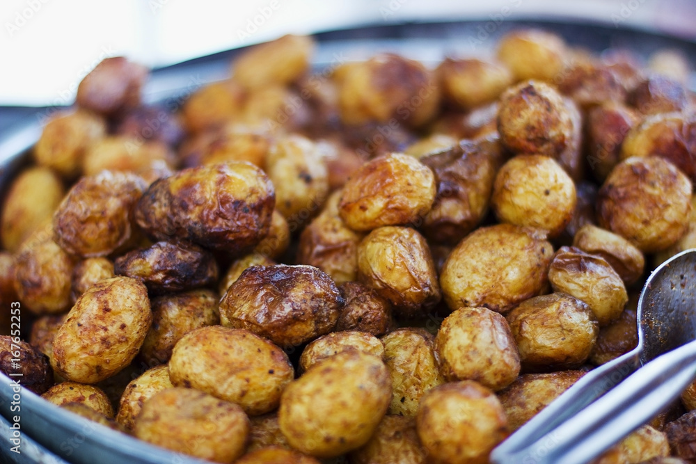 Baked yellow brown young patatoes Baked yellow brown young patatoes