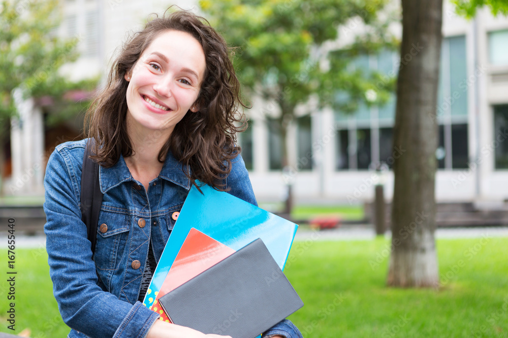 Portrait of a young student with backpack going to school and holding notebook - Back to school Portrait of a young student with backpack going to school and holding notebook - Back to school