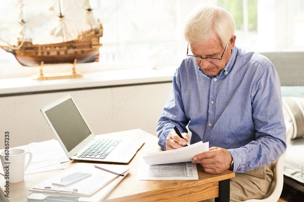 Senior Man Filing Tax Report Senior Man Filing Tax Report