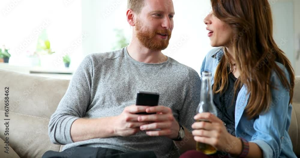 Young beautiful couple flirting and smiling at home Young beautiful couple flirting and smiling at home