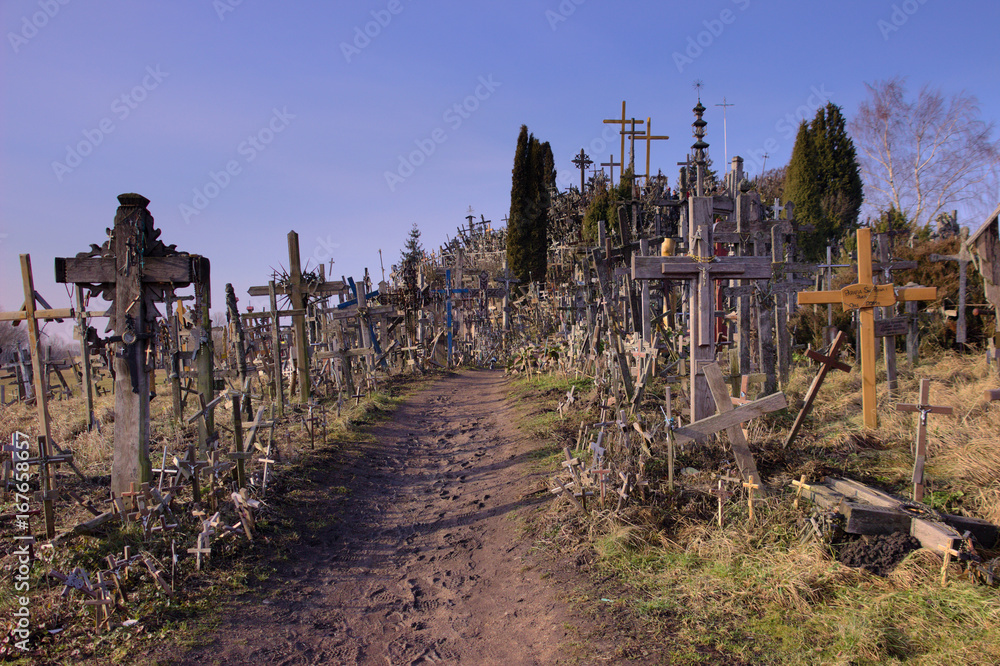 A small muddy track leading through the Hill of Crosses. Northern Lithuania. A small muddy track leading through the Hill of Crosses. Northern Lithuania.