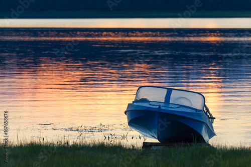 Kenozersky National Park, Russia. An old blue aluminum motorboat called 