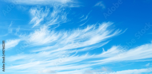 Blue sky with light cirrus clouds photo