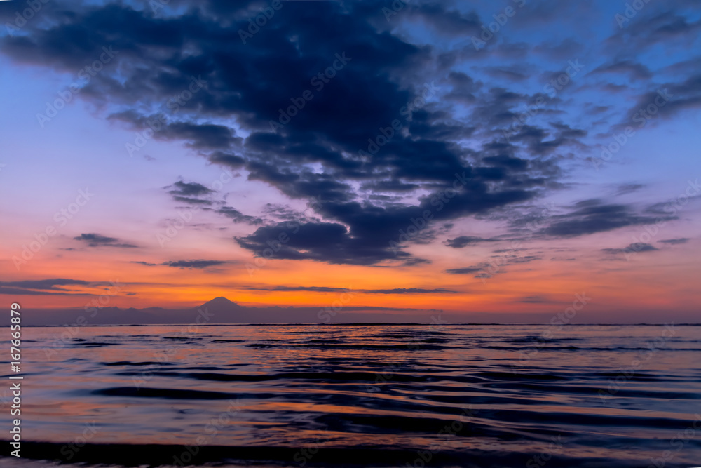 Scencis View of Paradise Beach During Sunset Against Bali Vulcano