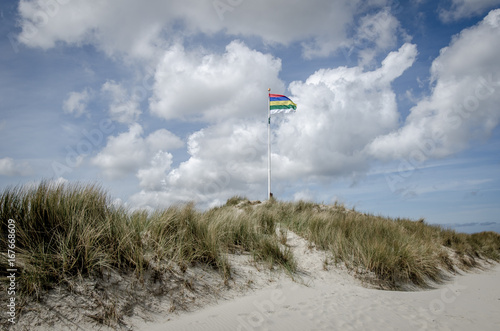 Flag of terschelling on a dune photo
