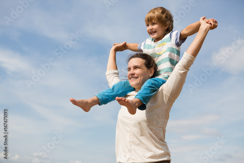Portrait of happy mother and little son Having Fun outdoor