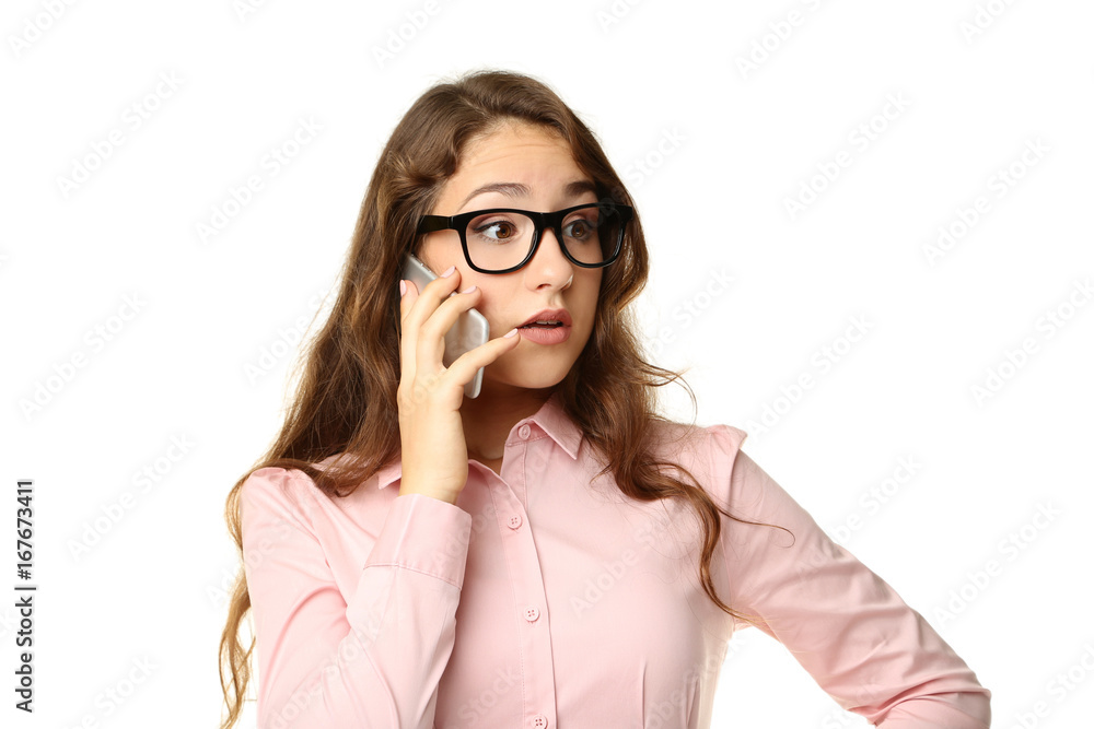 Portrait of young woman with smartphone on white background