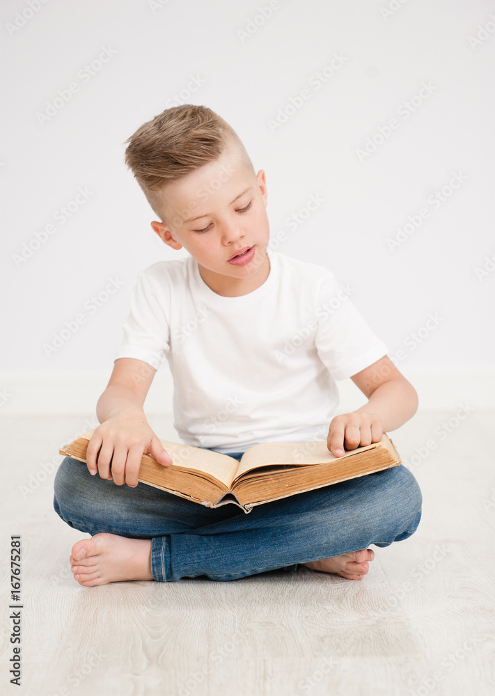 Boy is reading a book Boy is reading a book