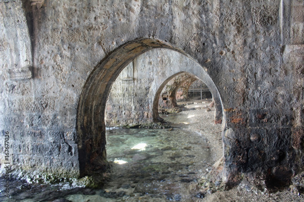 Arched galleries and rooms inside the ancient shipyard (Alanya, Turkey).
