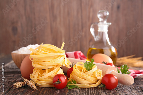 raw tagliatelle with ingredient and oil