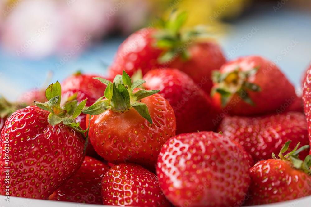 Ripe red strawberries in white bowl. Ripe red strawberries in white bowl.