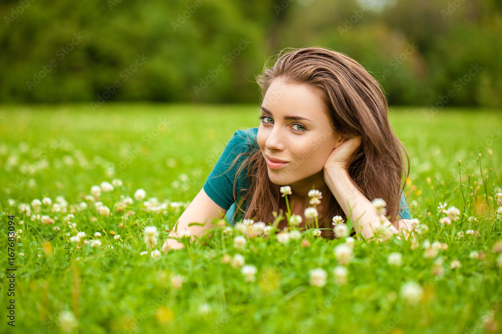 Young beautiful brown haired woman in blue jeans Young beautiful brown haired woman in blue jeans