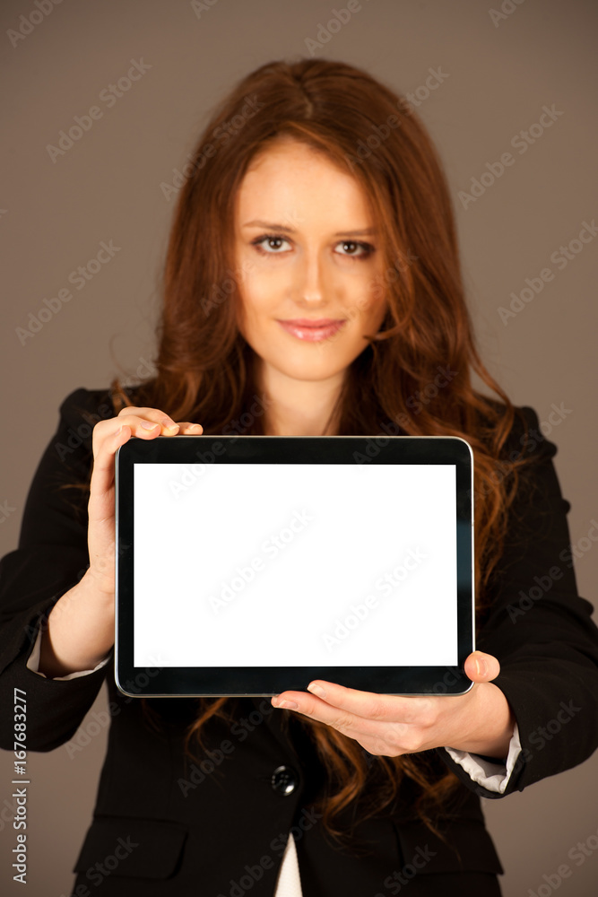 attractive business woman holds a tablet or smartphone wtih blank copy space for additional graphic or text attractive business woman holds a tablet or smartphone wtih blank copy space for additional graphic or text