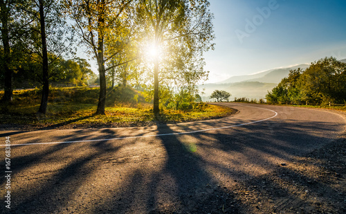 mountainous countryside road at sunrise