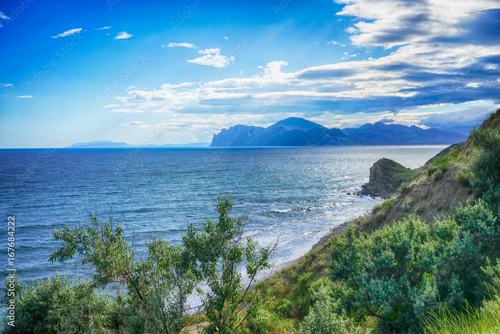 Marine landscape with views of hills, mountains covered with greenery ...
