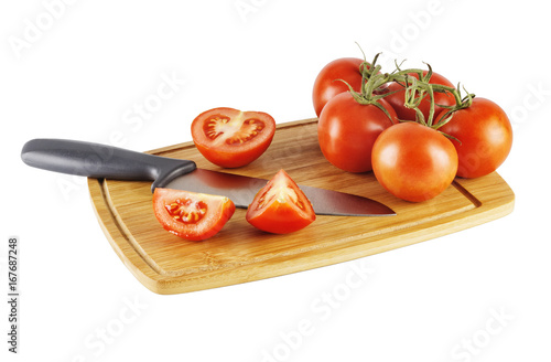Tomatoes on a chopping Board and knife