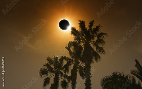 Total solar eclipse in dark glowing sky