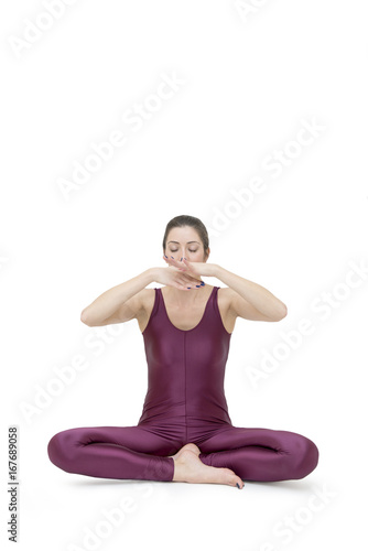 Woman practicing yoga in Muktasana pose