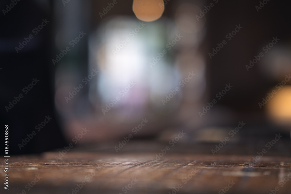 Vintage wooden table with blur bokeh background on cafe - obrazy, fototapety, plakaty 
