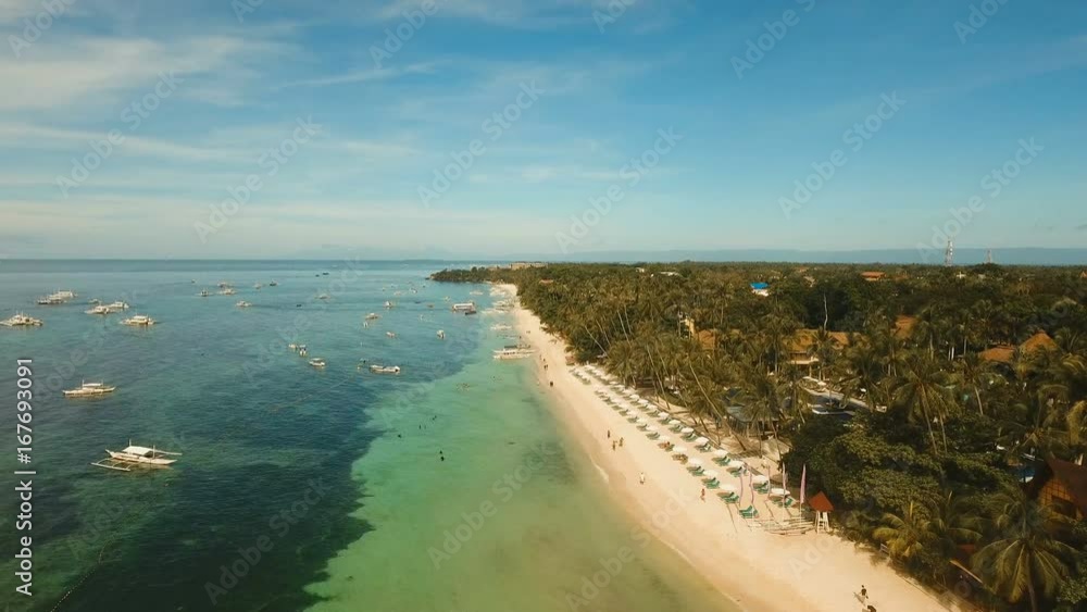 Aerial view of tropica Alona beach on the island Bohol, resort, hotels, Philippines. Beautiful tropical island with sand beach, palm trees. Tropical landscape. Seascape: Ocean, sky, sea. 4K video Aerial view of tropica Alona beach on the island Bohol, resort, hotels, Philippines. Beautiful tropical island with sand beach, palm trees. Tropical landscape. Seascape: Ocean, sky, sea. 4K video