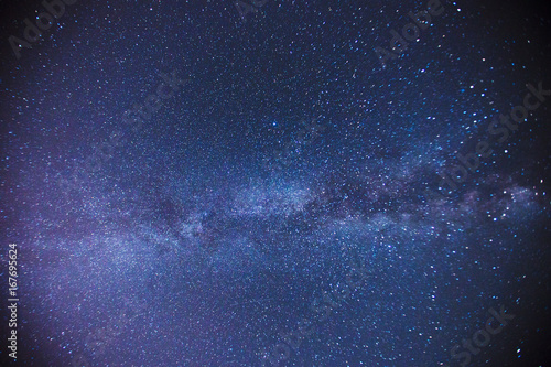 The starry sky above the barn at the farm at night