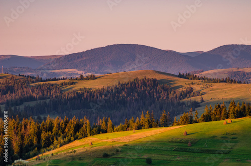 Background with Ukrainian Carpathian Mountains during the sunset in the Pylypets © zyoma_1986