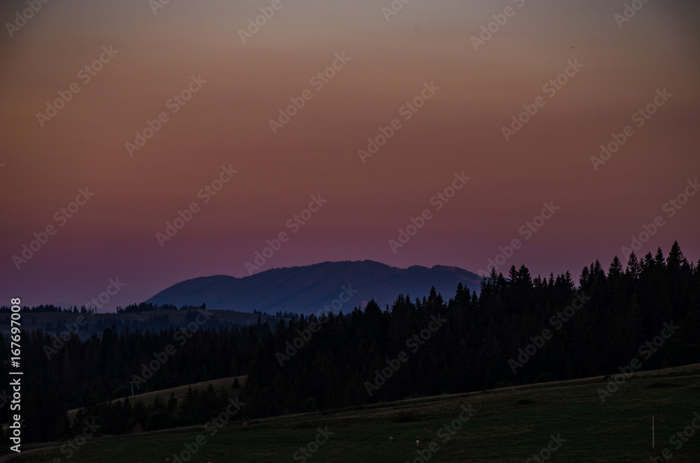 Background with Ukrainian Carpathian Mountains during the sunset in the Pylypets